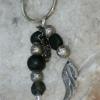 Glass beads with silver accent keychain with angel wing charm. $10