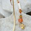 Shell, carnelian, and glass hook style bookmark with angel charm. $15
