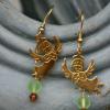 Designer glass earrings with angel. $10