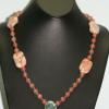 Shell pendant and Jasper necklace highlighted withCherry Quartz and Jade beads. Chic collection. 23" in length. $40
