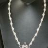 Glass bead necklace accented with silver spacers and silver start pendant. Classic collection. 23" long. $30