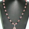 Rhodochrosite pendant and beads with black onyx. Chic collection. 24" long.  [Protection, self-esteem, and confidence] $70