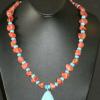 Red coral and turquoise necklace highlighted with turquoise pendant. Chic collection. 23" long. [Mood swings, prosperity, success, depression, stamina, and fertility] $60
