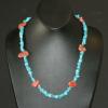 Turquoise chip necklace highlighted with coral nuggets. Chic collection. 23" long. [Mood swings, prosperity, success, depression, stamina, and fertility] $40