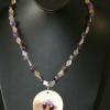 Amethyst and rutilated quartz necklace with unique flower shell pendant. Chic collection. 21" long. [Love, courage, protection, creativity, depression, and lonliness] $40