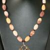 Jasper and glass bead necklace highlighted with unique shell pendant. Chic collection. 23" long. [Stress, courage, and honesty] $55