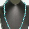 Turquoise intertwined with shell beads necklace. Chic collection. 26" long. [Mood swings, prosperity, success, and love] $50